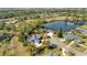 Aerial view of home on a tree-lined street, near a lake at 217 Pleasant Valley Dr, Daytona Beach, FL 32114