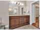 Bathroom with double vanity and rich wood cabinets at 217 Pleasant Valley Dr, Daytona Beach, FL 32114