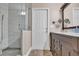 Bathroom with a large glass shower and dark vanity at 217 Pleasant Valley Dr, Daytona Beach, FL 32114