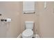 Small bathroom with a toilet and a window at 217 Pleasant Valley Dr, Daytona Beach, FL 32114