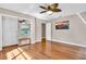 Bedroom with mirrored closet, wood floors and a TV at 217 Pleasant Valley Dr, Daytona Beach, FL 32114