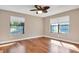 Well-lit bedroom featuring wood floors and two windows at 217 Pleasant Valley Dr, Daytona Beach, FL 32114