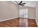 Spacious bedroom featuring hardwood floors and sliding glass doors at 217 Pleasant Valley Dr, Daytona Beach, FL 32114