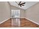 Bright bedroom with hardwood floors and sliding glass doors leading to a patio at 217 Pleasant Valley Dr, Daytona Beach, FL 32114