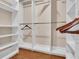 Bright walk-in closet with built-in shelving at 217 Pleasant Valley Dr, Daytona Beach, FL 32114