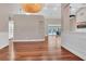 Hardwood floor dining room with built-in shelving and views to the pool at 217 Pleasant Valley Dr, Daytona Beach, FL 32114