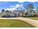 Brick house with yellow door and landscaped yard at 217 Pleasant Valley Dr, Daytona Beach, FL 32114