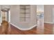 Hallway with built-in shelving and hardwood floors at 217 Pleasant Valley Dr, Daytona Beach, FL 32114