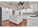 Modern white kitchen with center island and stainless steel appliances at 217 Pleasant Valley Dr, Daytona Beach, FL 32114