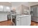 Modern kitchen with white cabinets, stainless steel appliances, and hardwood floors at 217 Pleasant Valley Dr, Daytona Beach, FL 32114