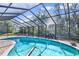 Sparkling pool with screened patio and lush views at 217 Pleasant Valley Dr, Daytona Beach, FL 32114