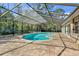 Inviting kidney-shaped pool with screened enclosure at 217 Pleasant Valley Dr, Daytona Beach, FL 32114