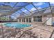 Relaxing kidney-shaped pool and screened patio at 217 Pleasant Valley Dr, Daytona Beach, FL 32114