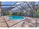 Tranquil pool area with screened enclosure at 217 Pleasant Valley Dr, Daytona Beach, FL 32114