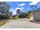 Landscaped side yard with a view of the garage at 217 Pleasant Valley Dr, Daytona Beach, FL 32114