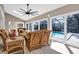 Sunroom with wicker furniture and view of the pool at 217 Pleasant Valley Dr, Daytona Beach, FL 32114