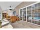 Bright sunroom overlooking the pool, featuring wicker furniture at 217 Pleasant Valley Dr, Daytona Beach, FL 32114