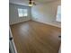 Spacious bedroom with light wood laminate flooring and ceiling fan at 2210 Stonington Ave # 2210, Orlando, FL 32817