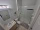 Clean bathroom with shower/tub combo, vanity, and tiled floors at 2407 Silver Palm Dr, Kissimmee, FL 34747