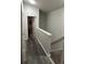 Upstairs hallway with wood-look floors at 2407 Silver Palm Dr, Kissimmee, FL 34747