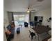 Spacious living area with pool view, dining table, and comfortable seating at 2407 Silver Palm Dr, Kissimmee, FL 34747