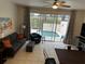 Living room with view of the pool and lanai at 2407 Silver Palm Dr, Kissimmee, FL 34747