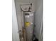 A.O. Smith water heater with Energy Guide sticker and assorted plumbing in an enclosed space at 2407 Silver Palm Dr, Kissimmee, FL 34747