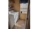 Bright laundry room with washer, dryer, and storage at 241 Shady Ln, Deland, FL 32724