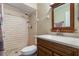 Bathroom with shower/tub combo, vanity with granite top and wood cabinet at 2752 Sedgefield Ave, Deltona, FL 32725