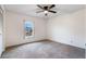 Bright bedroom with neutral walls, window, and ceiling fan at 2752 Sedgefield Ave, Deltona, FL 32725