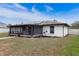 House exterior with screened patio and landscaping at 2752 Sedgefield Ave, Deltona, FL 32725