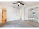 Main bedroom with mirrored closet doors and access to bathroom at 2752 Sedgefield Ave, Deltona, FL 32725