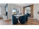 Elegant dining area with a modern table and blue velvet chairs at 2904 Moulin Rd, Davenport, FL 33837