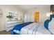 Serene bedroom with white dresser and en-suite bathroom at 2924 Moulin Rd, Davenport, FL 33837