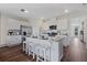 Modern kitchen with white cabinets and an island at 2928 Moulin Rd, Davenport, FL 33837