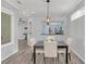 Light-filled dining area with view into the updated kitchen at 303 Foxhill Ct, Debary, FL 32713