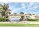 Well-maintained single-story house featuring a two-car garage at 303 Foxhill Ct, Debary, FL 32713