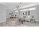 Open living room with gray walls and a view of the dining area at 303 Foxhill Ct, Debary, FL 32713