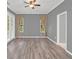 Spacious living room with neutral walls and wood-look flooring at 303 Foxhill Ct, Debary, FL 32713