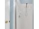 Bright shower with white tile and a handheld shower head at 303 Foxhill Ct, Debary, FL 32713