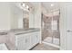 Modern bathroom with granite countertop and walk-in shower at 3138 Dark Sky Dr, Harmony, FL 34773