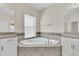 Elegant bathroom with corner soaking tub and double vanity at 3138 Dark Sky Dr, Harmony, FL 34773