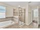 Main bathroom with soaking tub and walk-in shower at 3138 Dark Sky Dr, Harmony, FL 34773