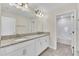 Double vanity bathroom with granite countertops and a tub at 3138 Dark Sky Dr, Harmony, FL 34773