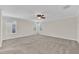 Spacious bedroom with carpeted floors and two windows at 3138 Dark Sky Dr, Harmony, FL 34773