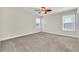 Bright bedroom featuring neutral walls and carpet at 3138 Dark Sky Dr, Harmony, FL 34773