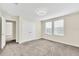 Well-lit bedroom with double doors leading to another room at 3138 Dark Sky Dr, Harmony, FL 34773