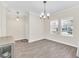 Bright dining area with hardwood floors and chandelier at 3138 Dark Sky Dr, Harmony, FL 34773