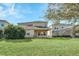 Two-story house with backyard and landscaping at 3138 Dark Sky Dr, Harmony, FL 34773