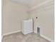 Clean laundry room with washer, dryer, and shelving at 3138 Dark Sky Dr, Harmony, FL 34773